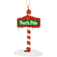 
              The North Pole Sign Covered in Snow Christmas Tree Ornaments
            