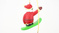 santa riding a snowboard