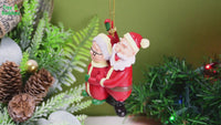 
              Santa and Mrs. Claus Under The Mistletoe Kissing Christmas Ornament
            